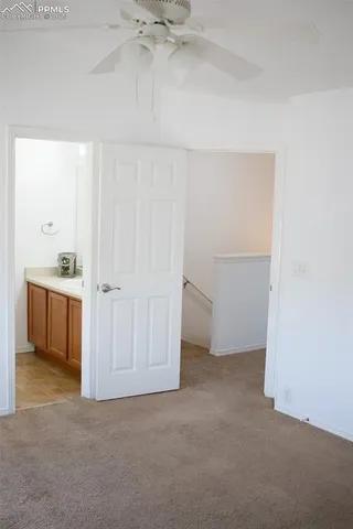 a white toilet sitting next to a shower curtain