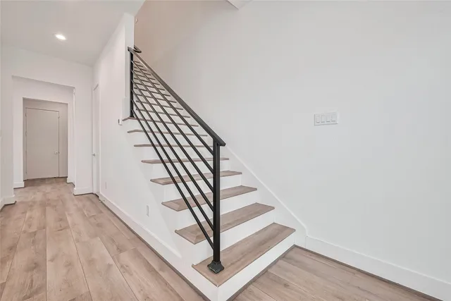 a view of entryway with wooden floor