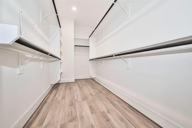 a bathroom with a granite countertop sink a toilet and bathtub