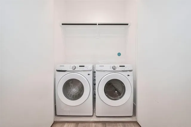 a view of a house with a yard and pathway