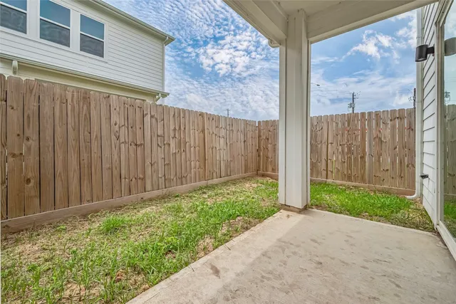 a view of a backyard of the house