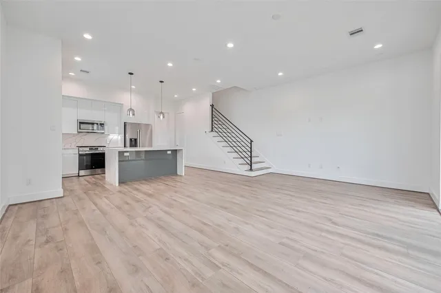 a view of kitchen and wooden floor