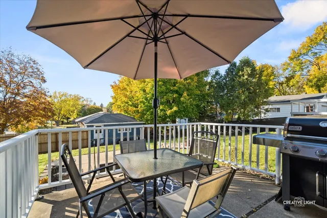 a view of a chair and table on the balcony