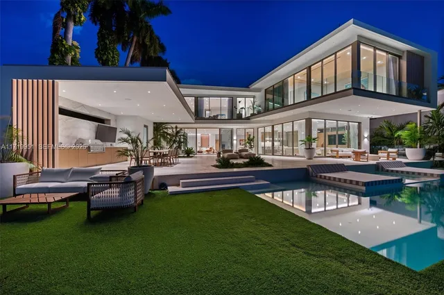 a swimming pool view with a seating space and a garden view