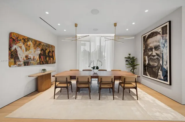 a living room with a large window and a flat screen tv