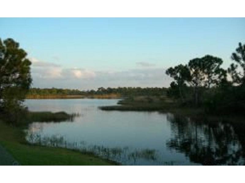 1255 Grant Road Grant, FL 32949 - Photo 6 of 6 a view of lake with green space