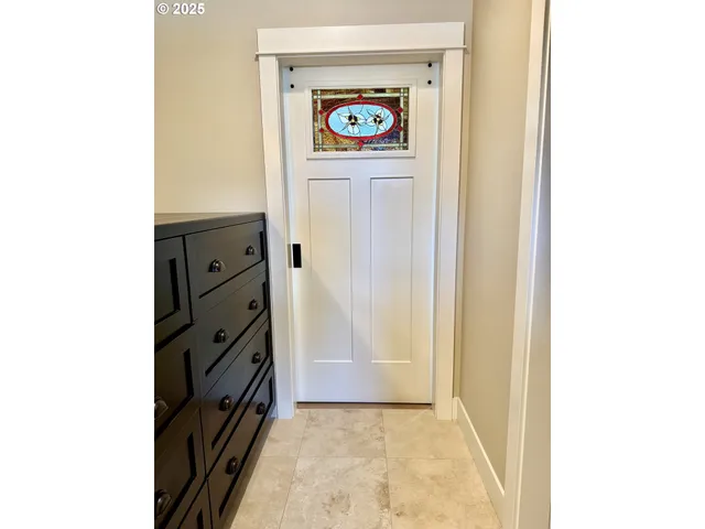 a view of a hallway with washer and dryer
