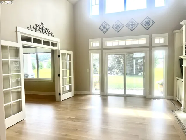 a view of an entryway with wooden floor