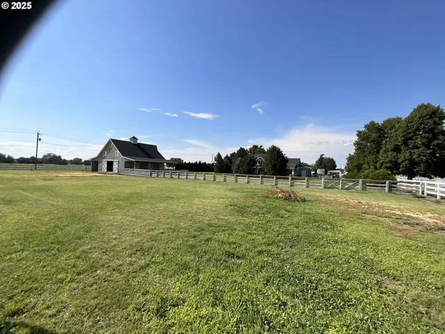 a view of a house with backyard porch and sitting area