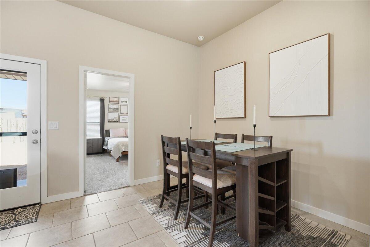 7440 32nd Street Lubbock, TX 79407 - Photo 13 of 29 a view of a dining room that has a table and chairs in it