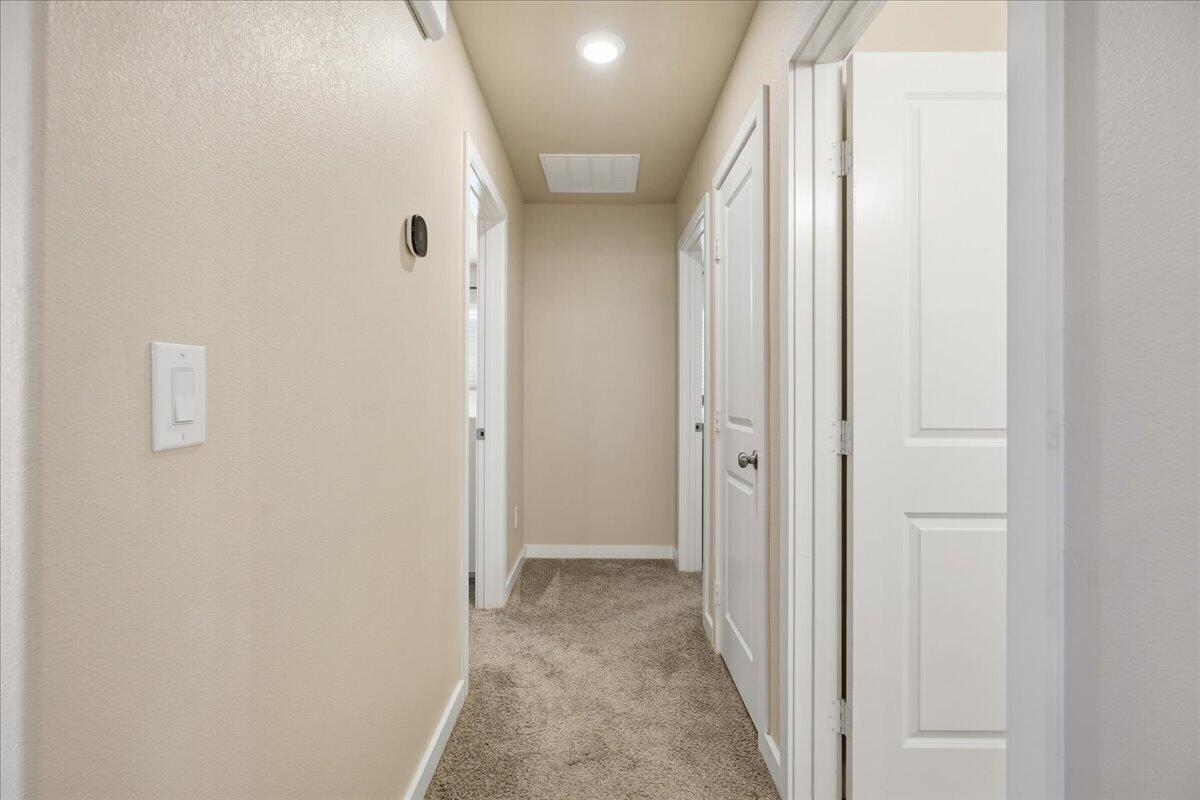 7440 32nd Street Lubbock, TX 79407 - Photo 20 of 29 a view of a hallway with wooden floor and entryway