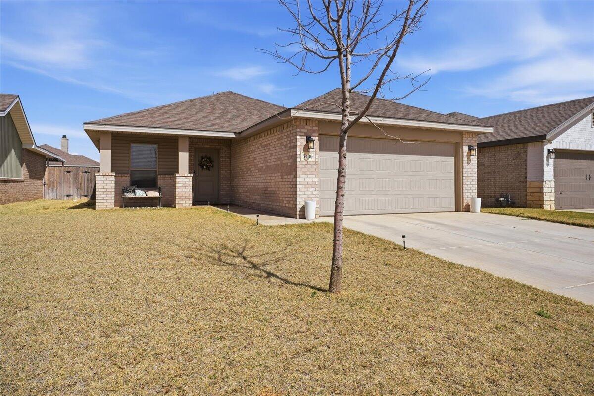7440 32nd Street Lubbock, TX 79407 - Photo 2 of 29 a view of a house with a snow in the yard