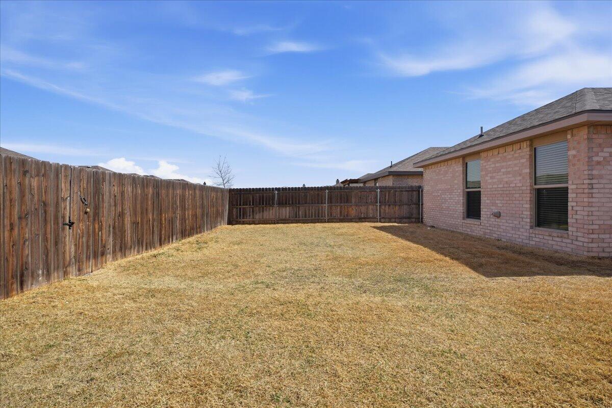 7440 32nd Street Lubbock, TX 79407 - Photo 28 of 29 a backyard of a house
