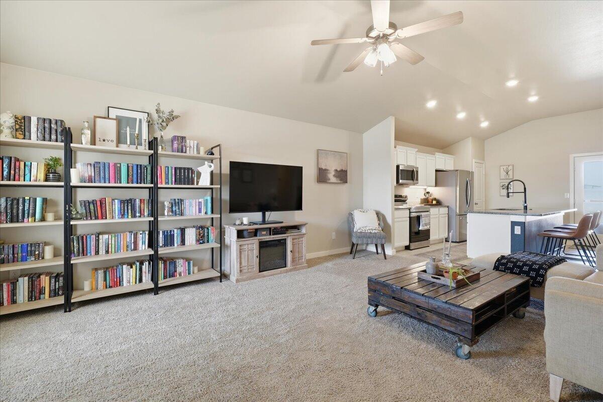 7440 32nd Street Lubbock, TX 79407 - Photo 4 of 29 a living room with furniture and a flat screen tv