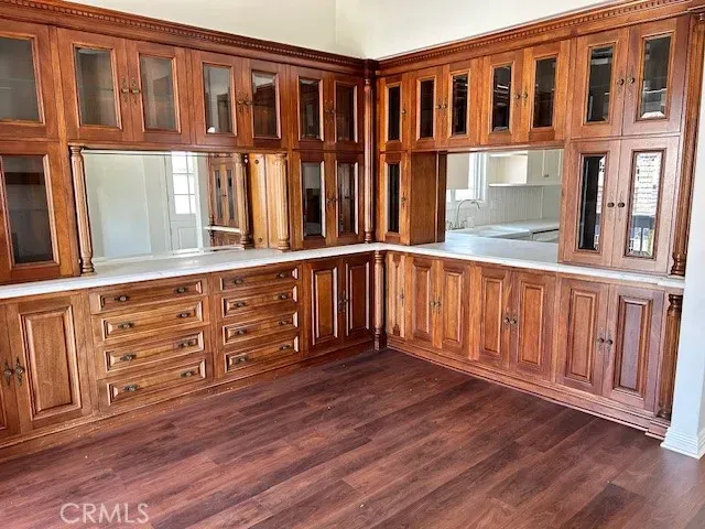 a view of kitchen with wooden floor and electronic appliances