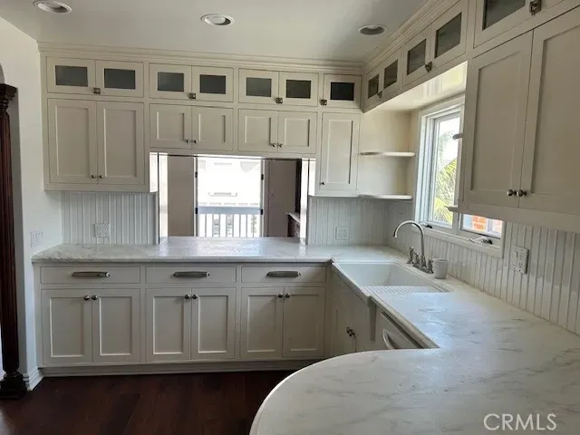 a kitchen with stainless steel appliances a refrigerator stove and cabinets