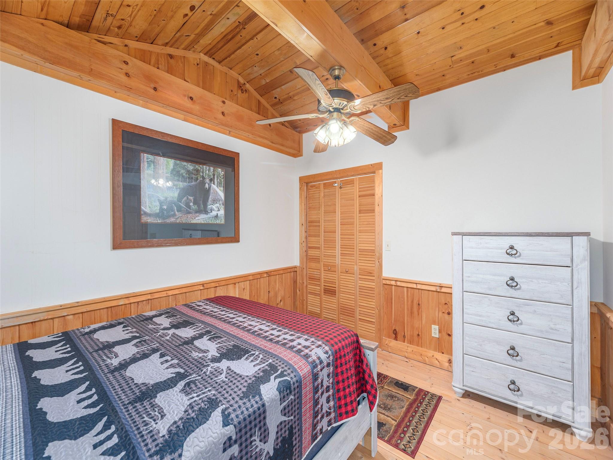 240 Plott Balsam Road Maggie Valley, NC 28751 - Photo 16 of 24 a bedroom with a bed and a closet