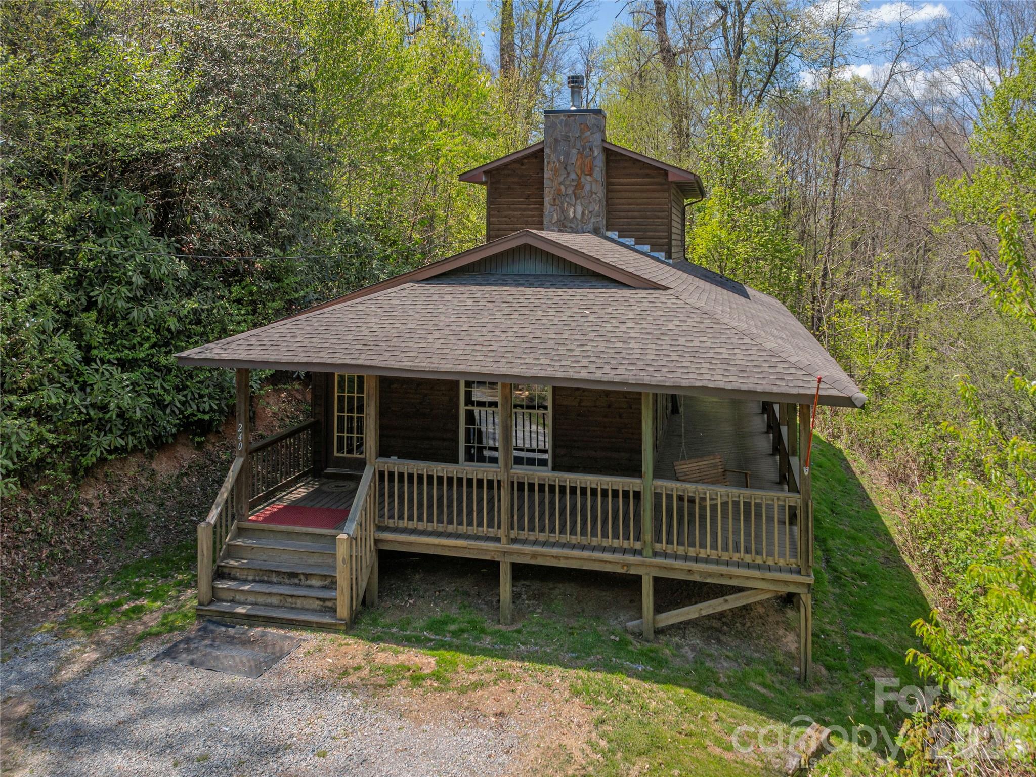 240 Plott Balsam Road Maggie Valley, NC 28751 - Photo 20 of 24 a front view of a house with a yard