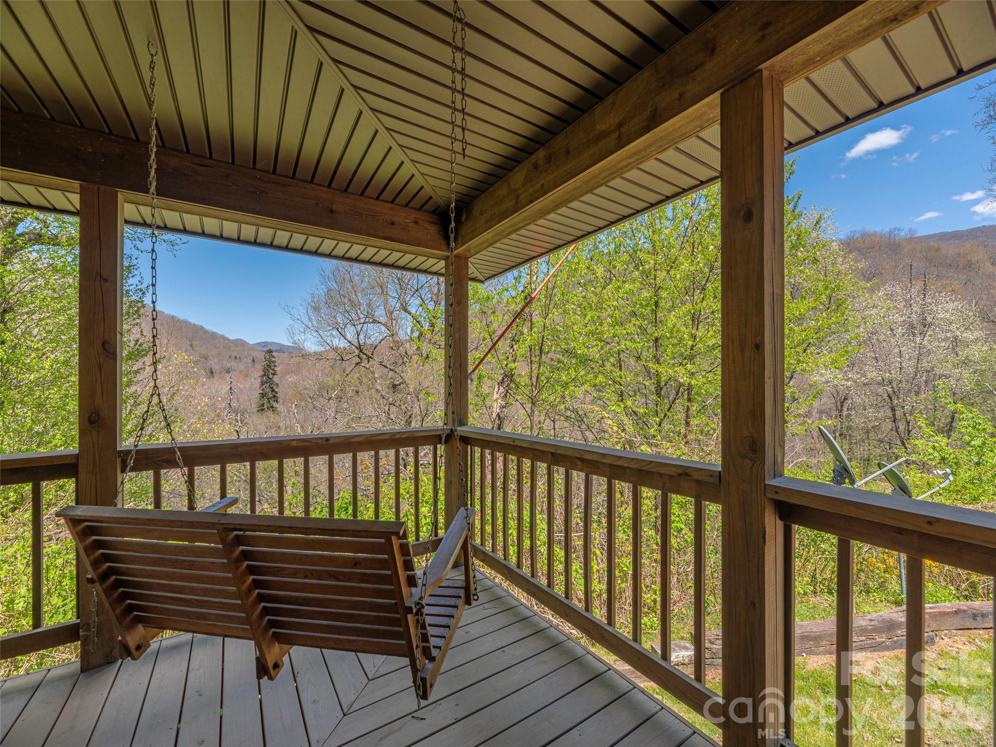 240 Plott Balsam Road Maggie Valley, NC 28751 - Photo 2 of 24 a view of wooden balcony with furniture