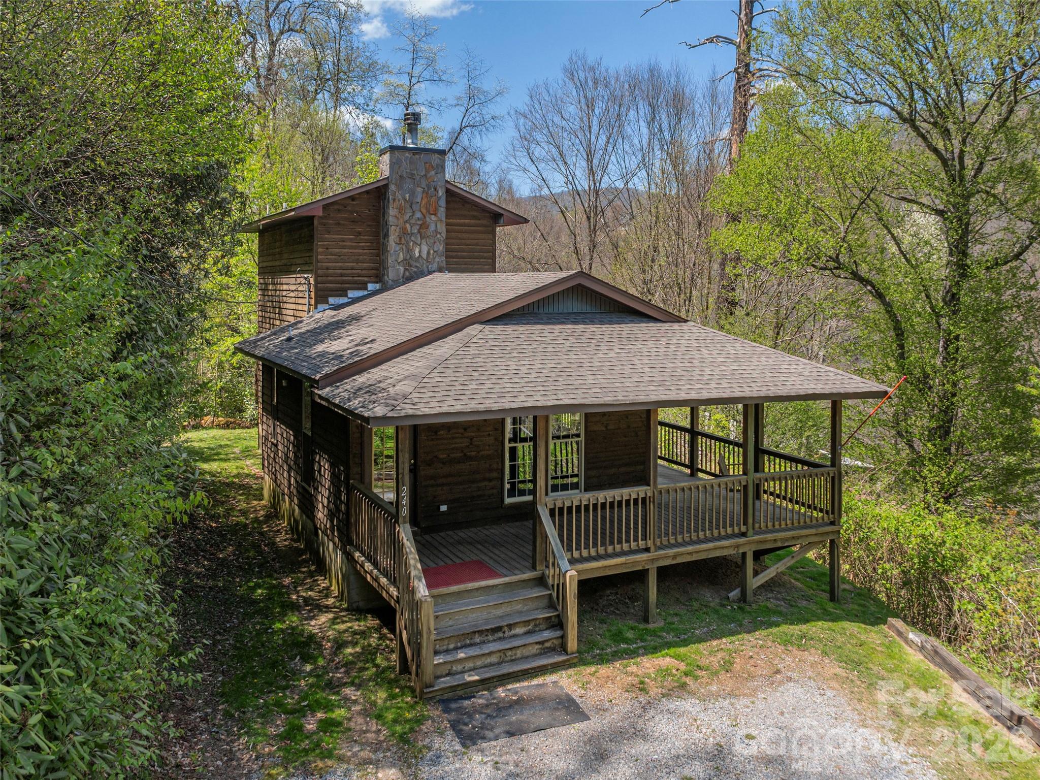 240 Plott Balsam Road Maggie Valley, NC 28751 - Photo 21 of 24 a view of house with outdoor seating area