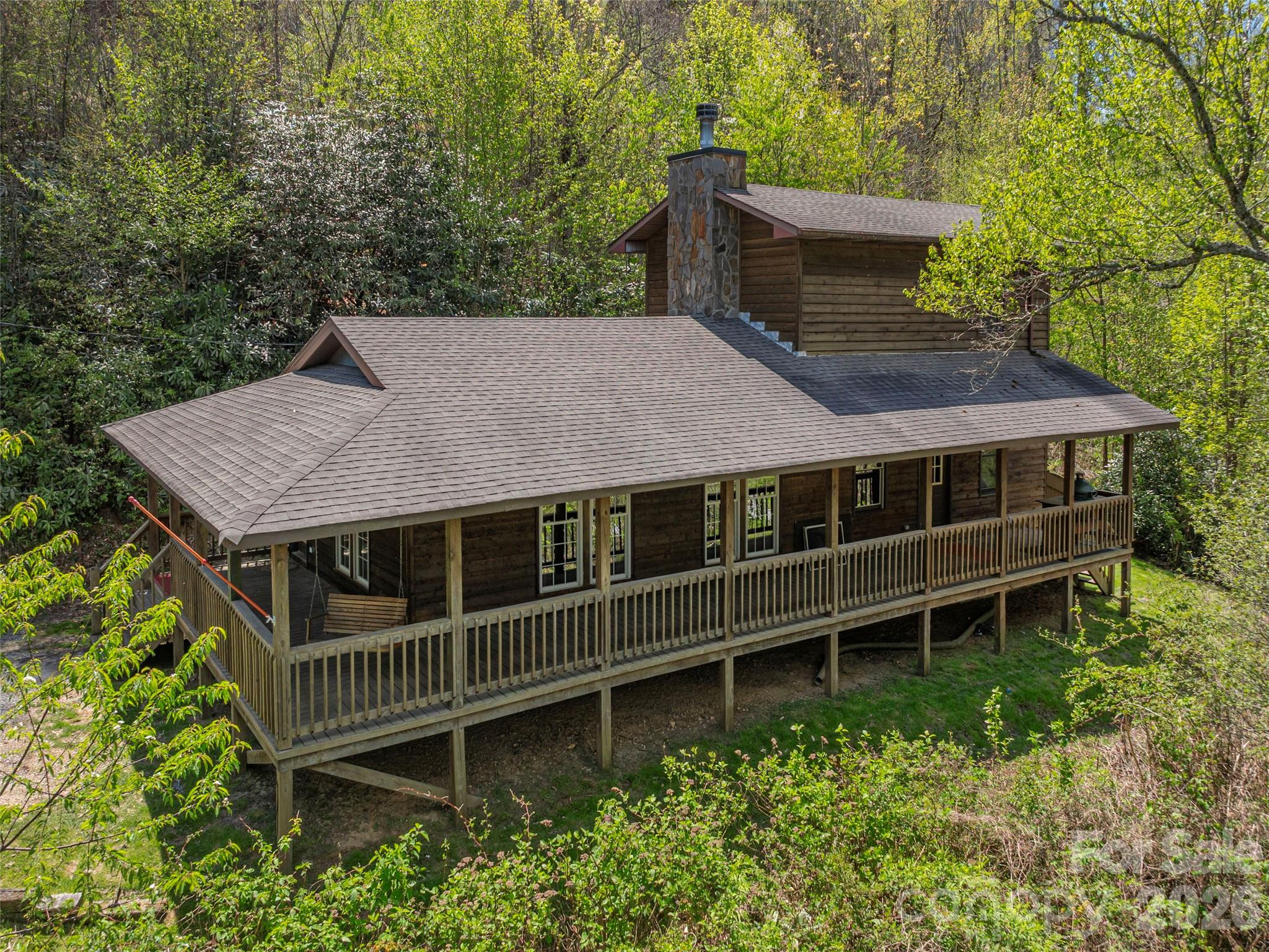 240 Plott Balsam Road Maggie Valley, NC 28751 - Photo 22 of 24 a balcony with a garden and deck