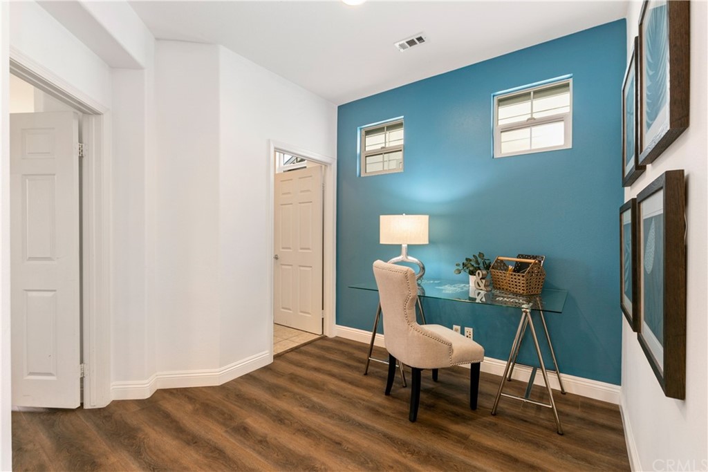 4 Bainbridge Avenue Ladera Ranch, CA 92694 - Photo 11 of 23 a view of a workspace with furniture and wooden floor