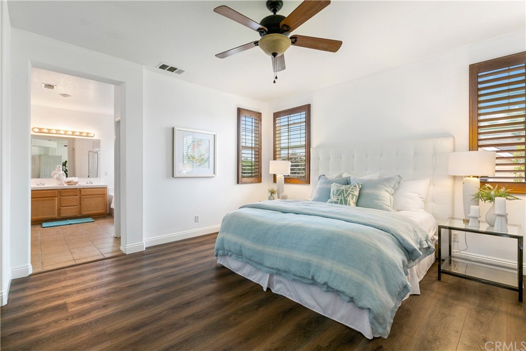 4 Bainbridge Avenue Ladera Ranch, CA 92694 - Photo 12 of 23 a bedroom with a bed and a chandelier