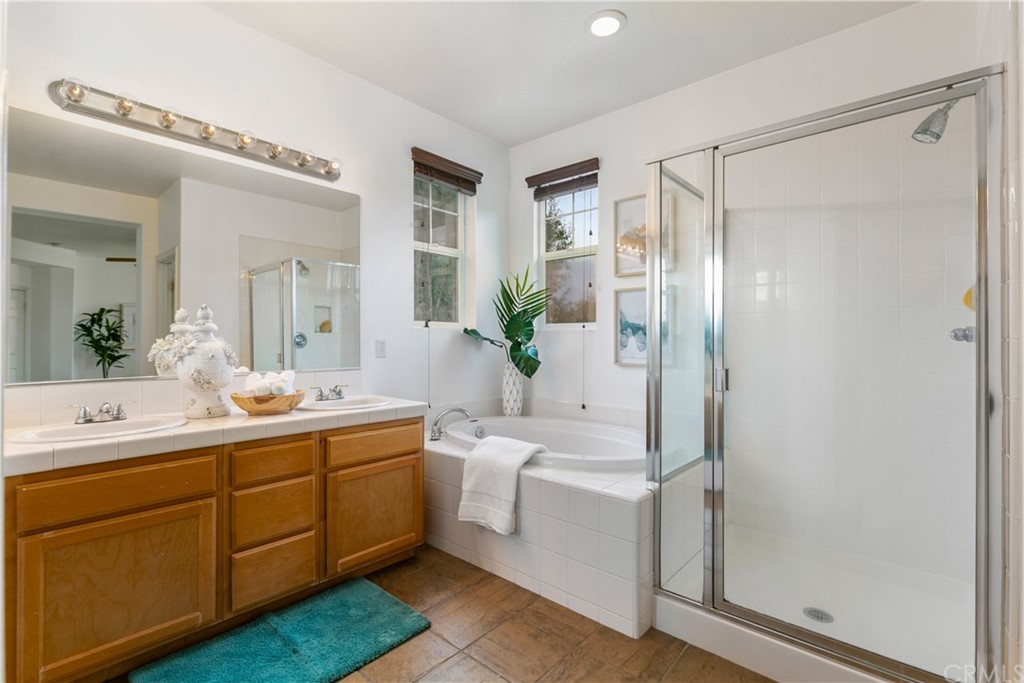 4 Bainbridge Avenue Ladera Ranch, CA 92694 - Photo 13 of 23 a bathroom with a double vanity sink mirror and shower