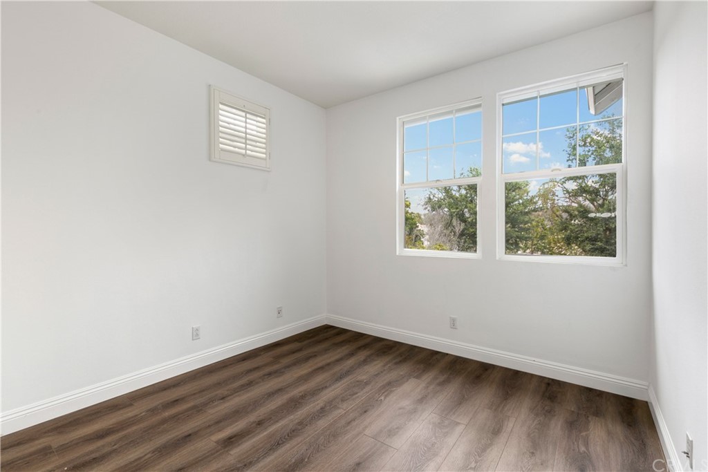4 Bainbridge Avenue Ladera Ranch, CA 92694 - Photo 15 of 23 a view of a room that has wooden floor and window
