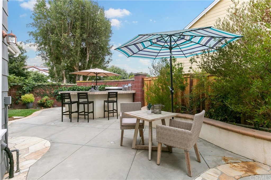 4 Bainbridge Avenue Ladera Ranch, CA 92694 - Photo 17 of 23 a patio with a patio table and chairs