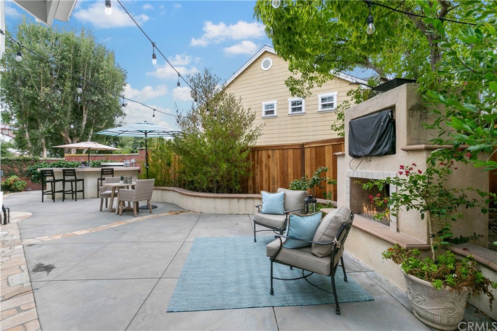 4 Bainbridge Avenue Ladera Ranch, CA 92694 - Photo 18 of 23 a backyard of a house with table and chairs