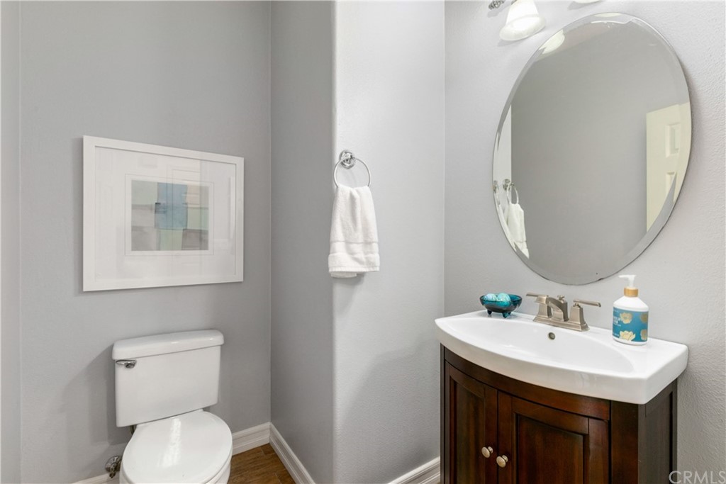 4 Bainbridge Avenue Ladera Ranch, CA 92694 - Photo 10 of 23 a bathroom with a sink mirror and toilet