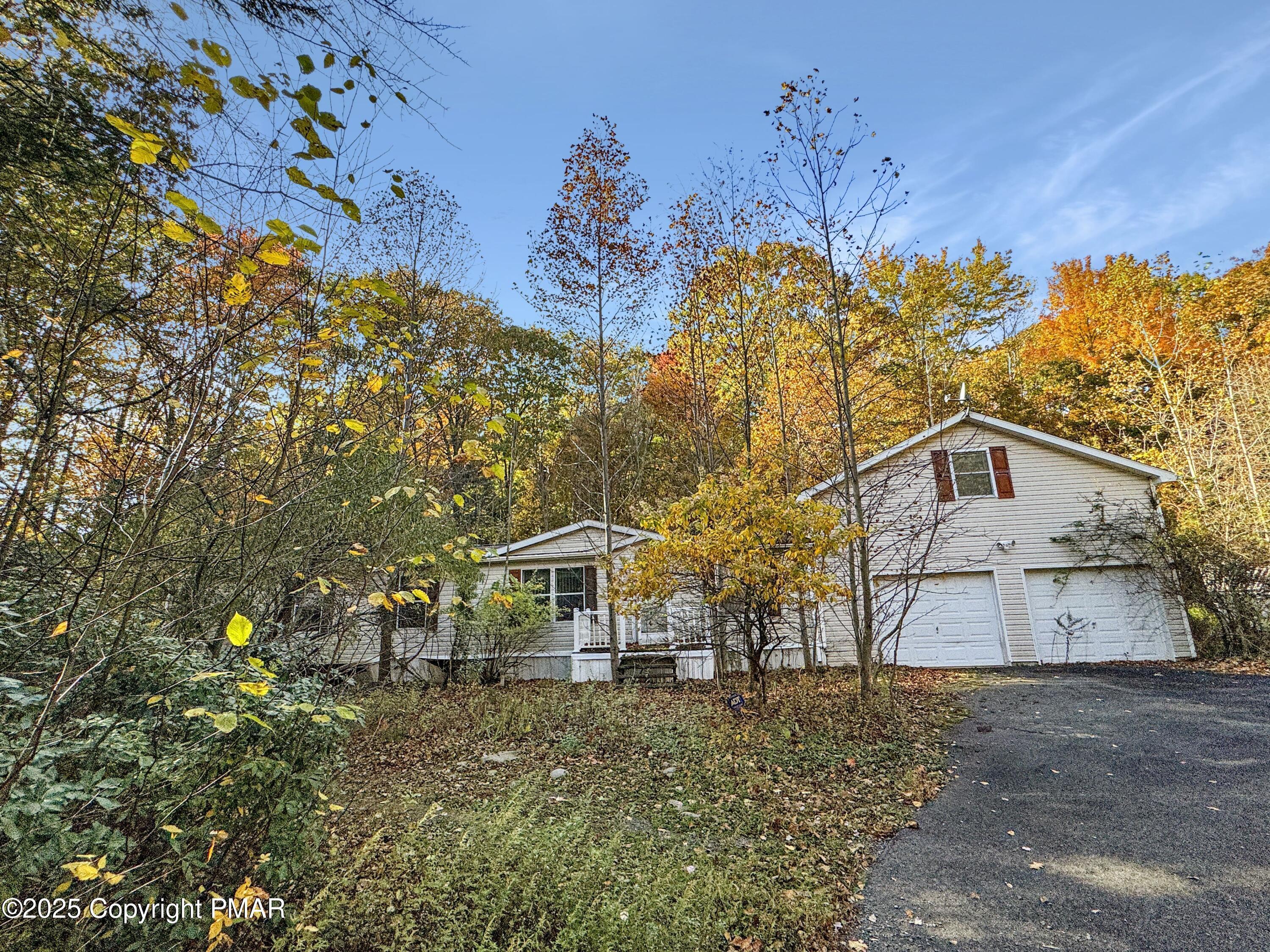 228 Victory Lane Stroudsburg, PA 18360 - Photo 3 of 8 a front view of a house with a yard