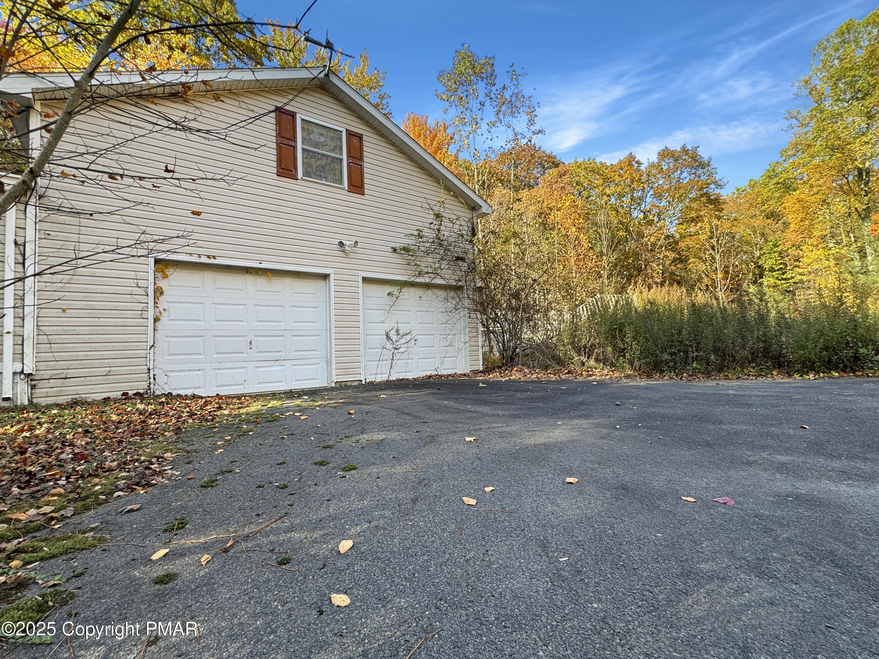 228 Victory Lane Stroudsburg, PA 18360 - Photo 4 of 8 a view of a house with a yard and garage