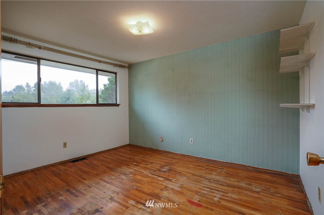 3004 Morrison Road West University Place, WA 98466 - Photo 22 of 39 an empty room with wooden floor and windows