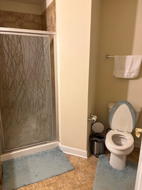 77 North Wolf Road, Unit 210 Northlake, IL 60164 - Photo 9 of 16 a white toilet sitting next to a shower