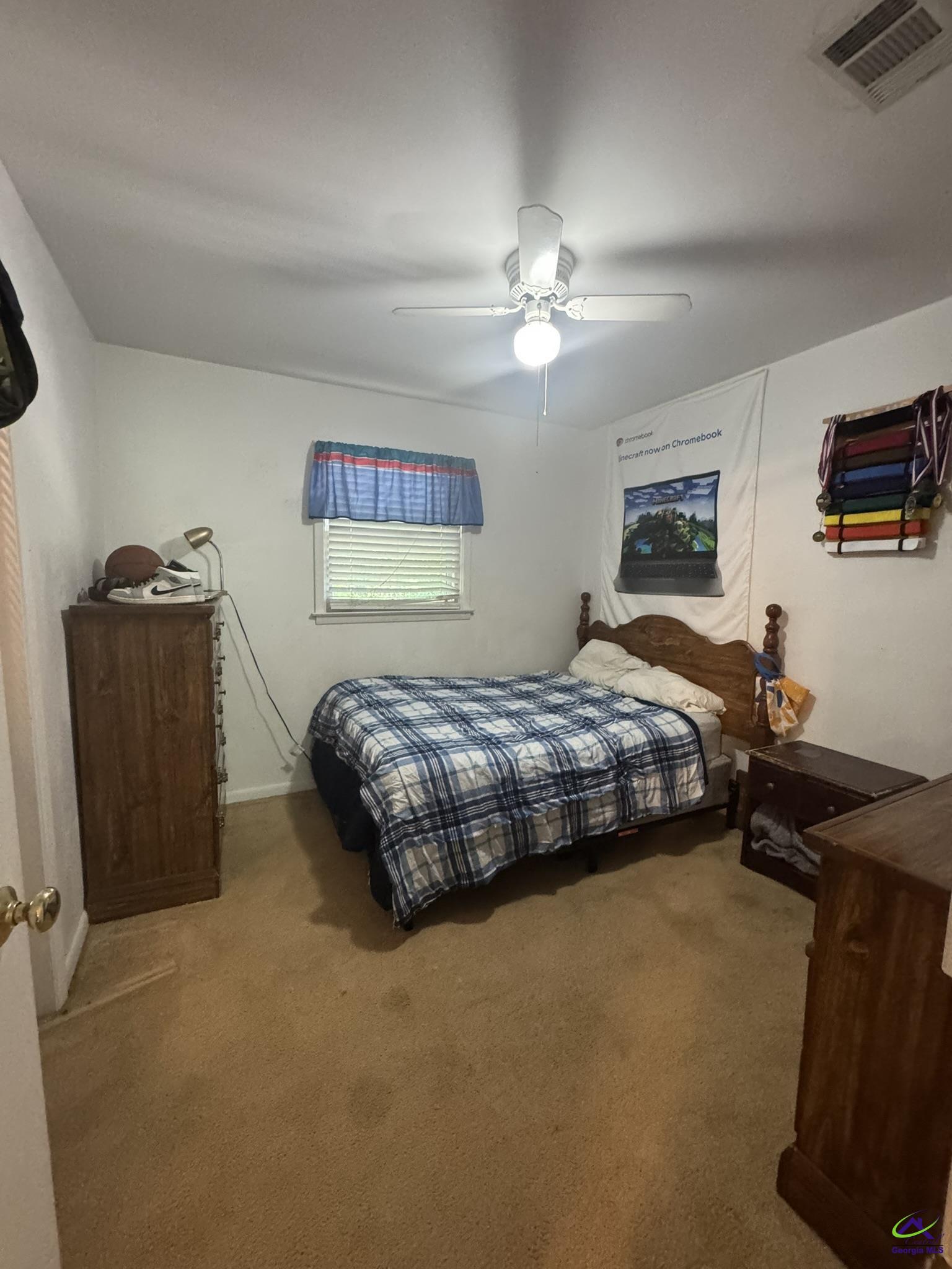1032 Elberta Road Warner Robins, GA 31093 - Photo 11 of 26 a bedroom with a bed and dresser