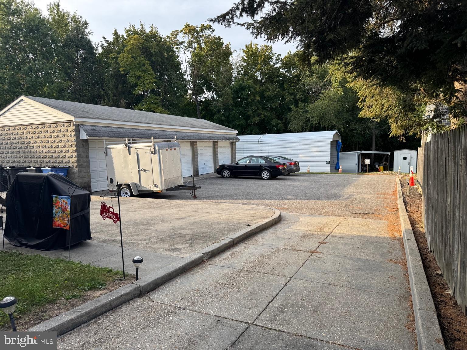 104 Main Street, Unit 4 Bridgeport, NJ 08014 - Photo 12 of 12 a view of a patio with a table and chairs under an umbrella