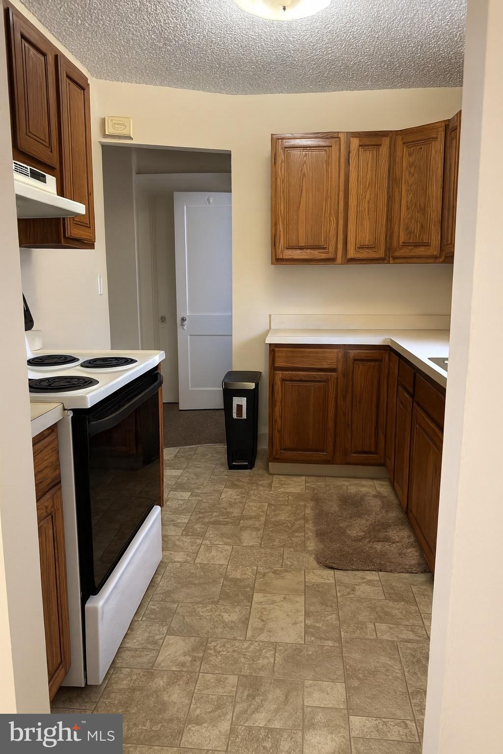 104 Main Street, Unit 4 Bridgeport, NJ 08014 - Photo 5 of 12 a kitchen with a stove and cabinets