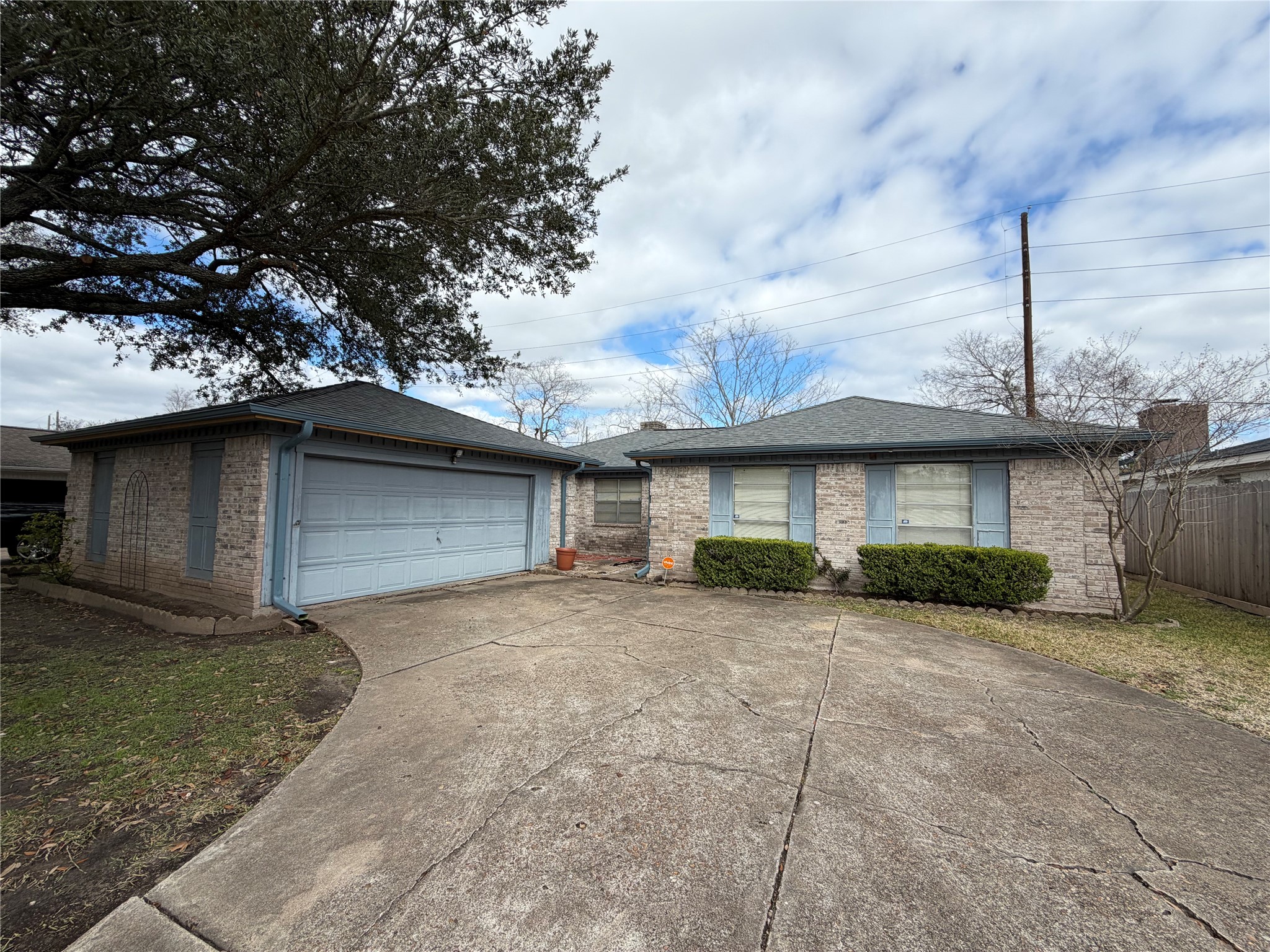 13722 Burgoyne Road Houston, TX 77077 - Photo 1 of 10 a front view of a house with a yard and garage