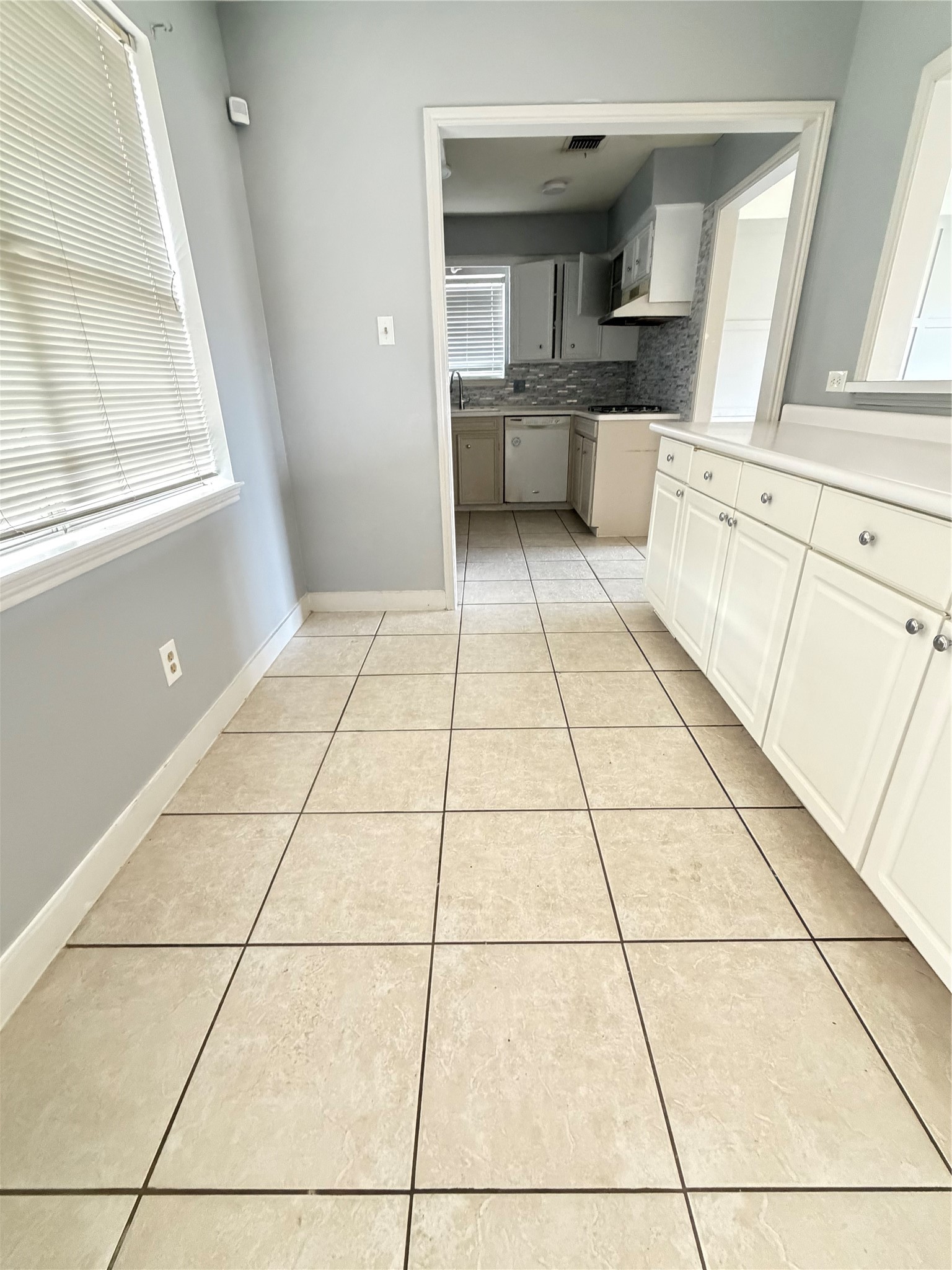 13722 Burgoyne Road Houston, TX 77077 - Photo 4 of 10 a view of kitchen with windows