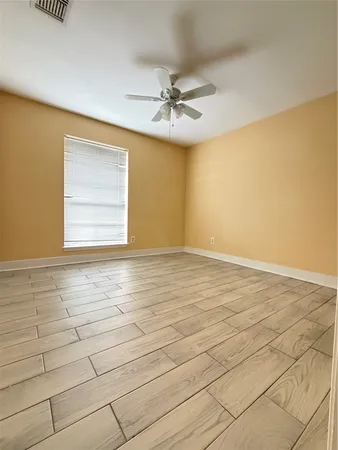 an empty room with a empty space and windows