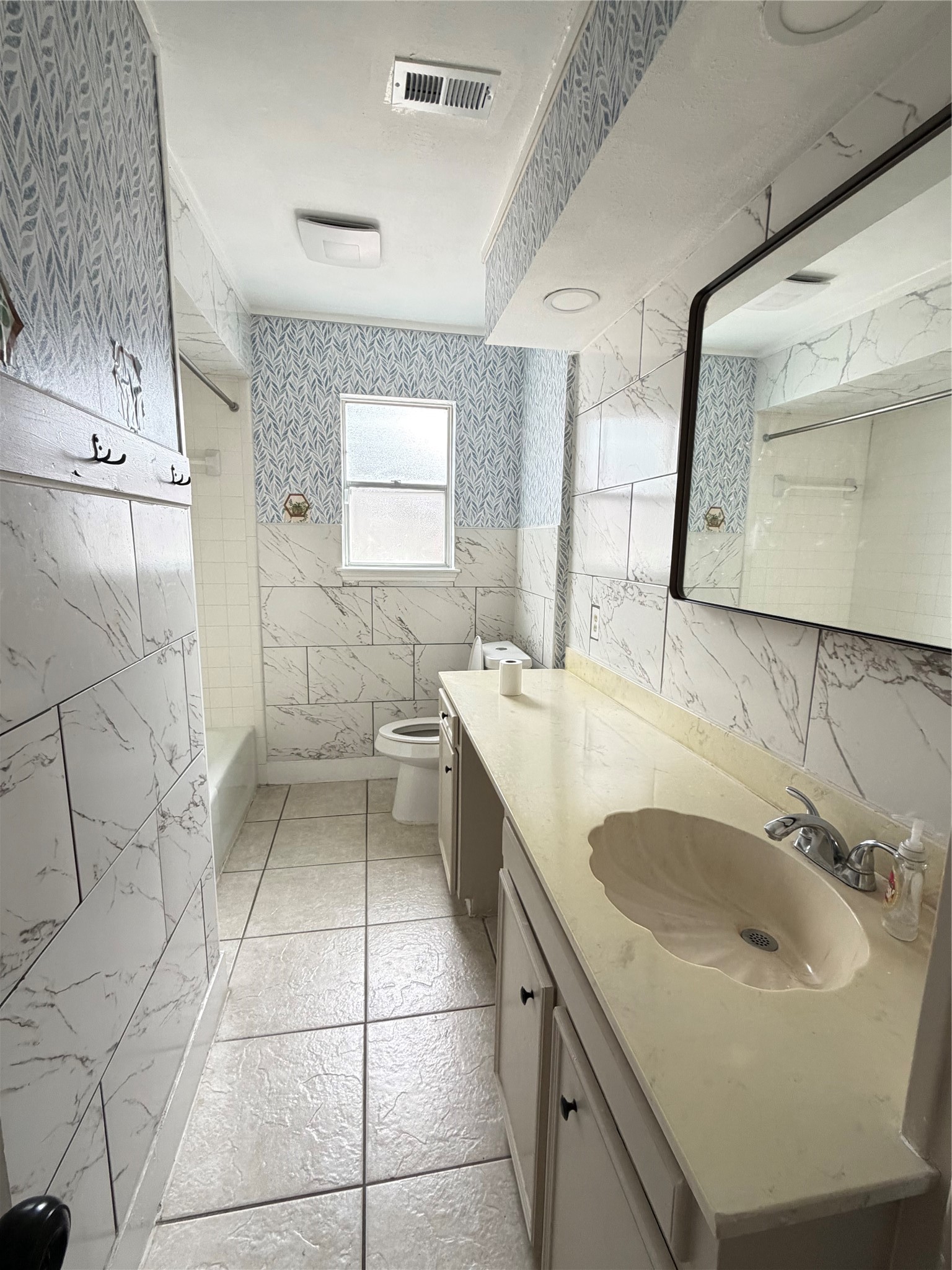 13722 Burgoyne Road Houston, TX 77077 - Photo 7 of 10 a bathroom with a sink a toilet and mirror