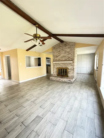 a view of an empty room and glass door