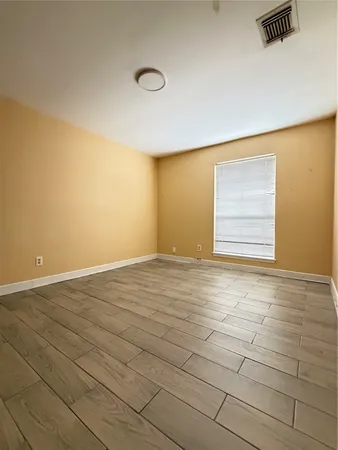 a view of an empty room and window