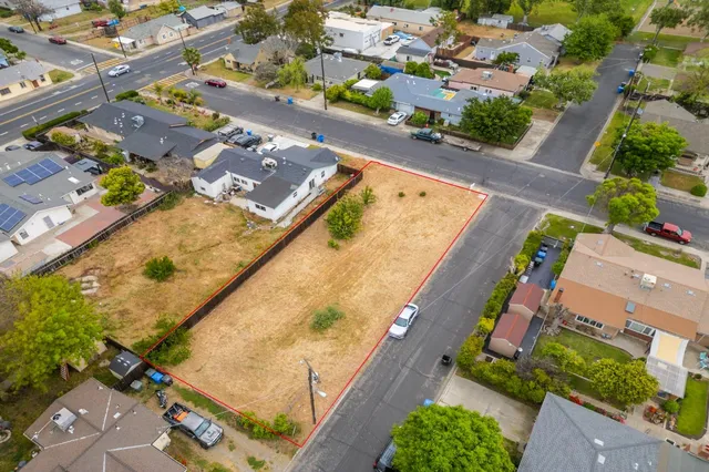 an aerial view of residential houses with outdoor space