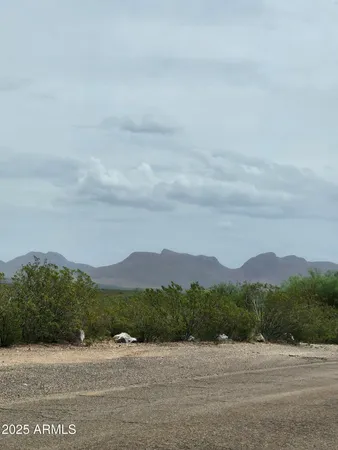 a view of mountain with sunset