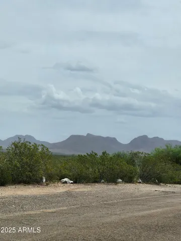 a view of mountain with sunset
