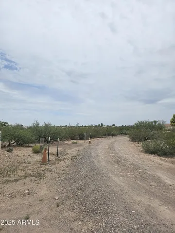 a view of a lake with houses in the back