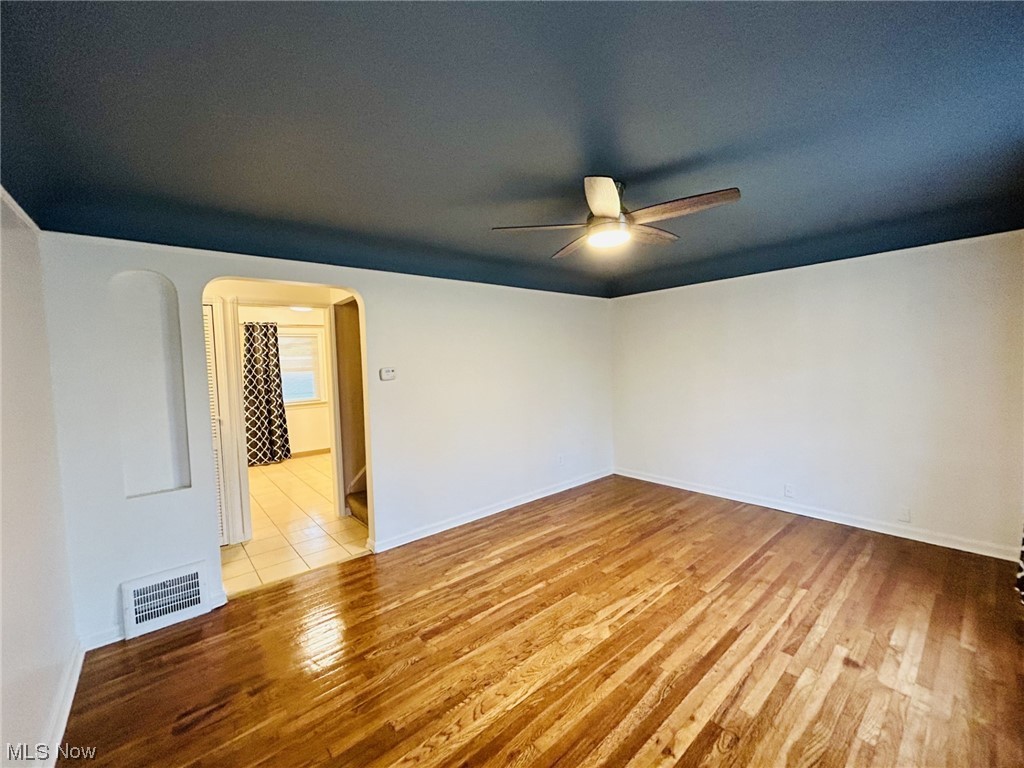 13414 Rockside Road Garfield Heights, OH 44125 - Photo 6 of 25 Spare room featuring ceiling fan and light hardwood / wood-style floors
